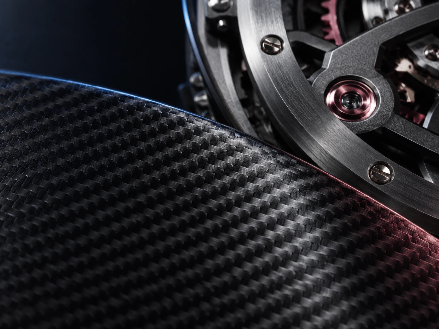 Macro visual study of carbon-fibre-style texture beside precision mechanical components